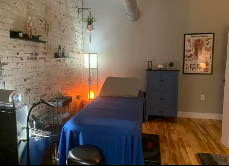 Softly lit treatment room with relaxing atmosphere