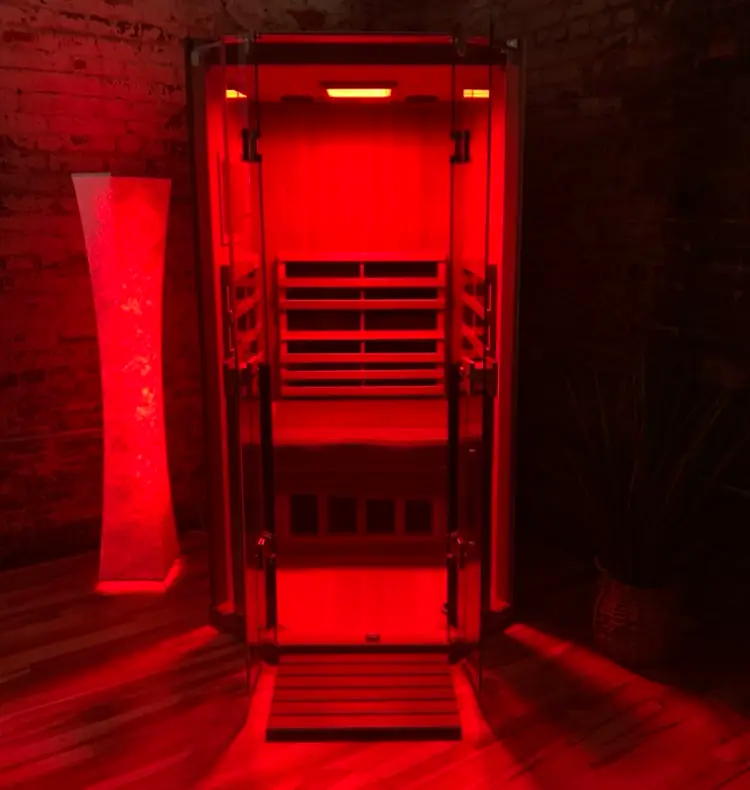 Infrared sauna interior with warm red lighting